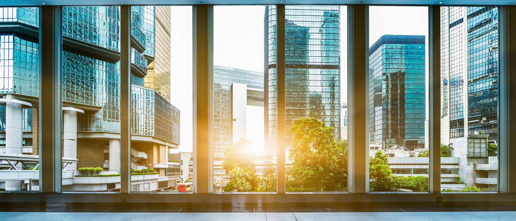 Panoramic view of corporate buildings through a window